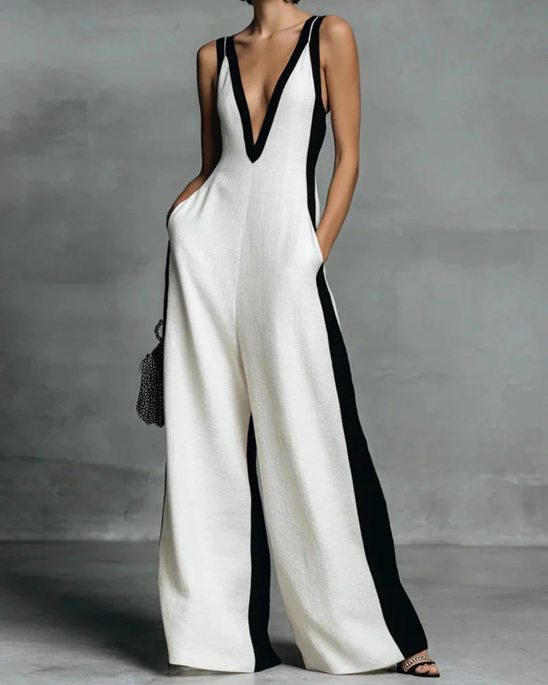 Black & White Stripe Wide-Leg Jumpsuit with Deep V-Neck